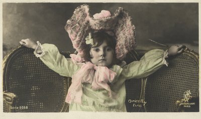 Little girl in a large hat by French Photographer